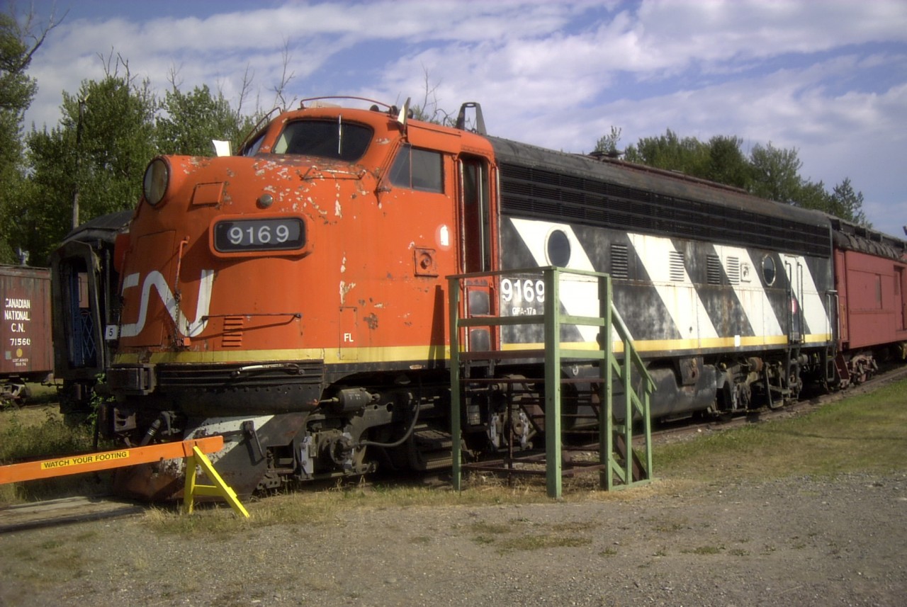 In deperate need of a repaint, CN 9169, a GFA-17a series unit sits on display at the PG museum along with several other members of the family. Note that the stripes lean forward towards the cab on this locomotive.  Keep an eye out for future photos that show variations of this paint scheme and the direction of the stripes are angled.