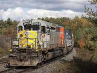 O480 sits in the siding waiting on the two north bound trains to clear on of them being CP423 and the other being CN M301 so they can continue they're trip south to Mac yard