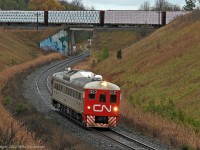 As CP 204 crosses above on the Belleville Sub, CN doodlebug 1501 heads up the York as train 471. 1340hrs.