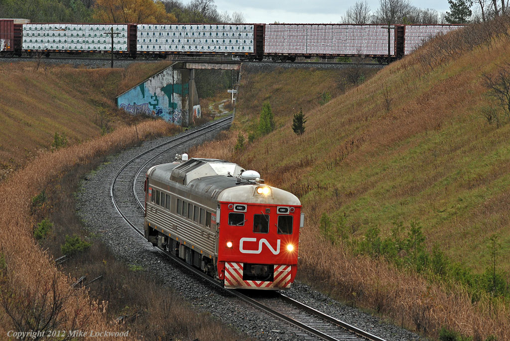 As CP 204 crosses above on the Belleville Sub, CN doodlebug 1501 heads up the York as train 471. 1340hrs.