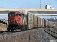 On a lazy afternoon, one-unit-wonder CN #275 with cowl-bodied Dash-8 2412 heads west with the usual solid racks of 275, past a hi-rail on the south track at Halwest before Bramalea GO Station.