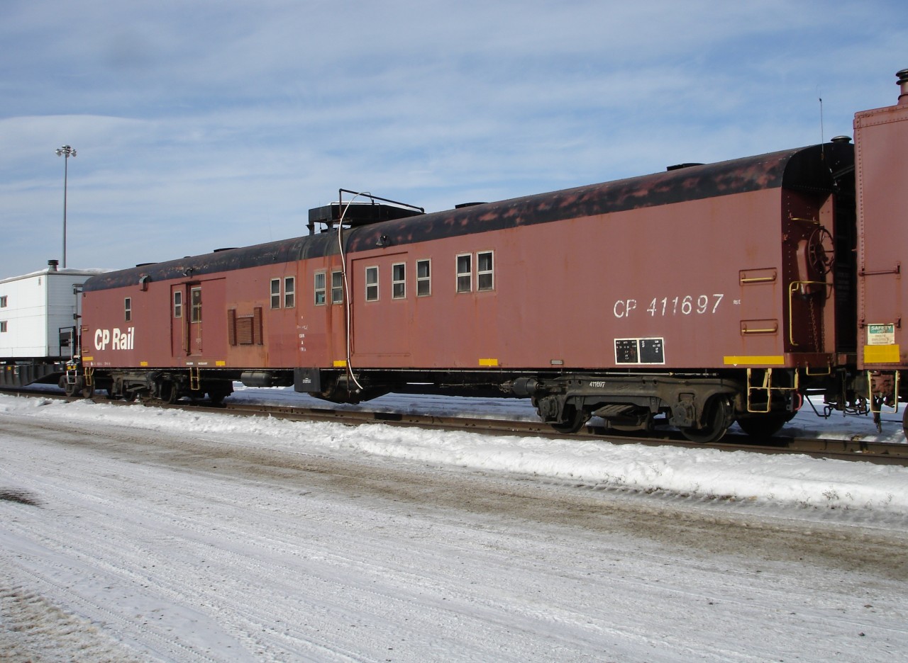 There's no smell of bacon & eggs or fresh hot coffee coming from CP 411697 today. The kitchen/diner car that accompanies the Golden, BC auxilliary train to derailments sits with the wrecking cranes and rest of the consist on the storage track in Golden fully prep'd and ready to go when the next call comes in.