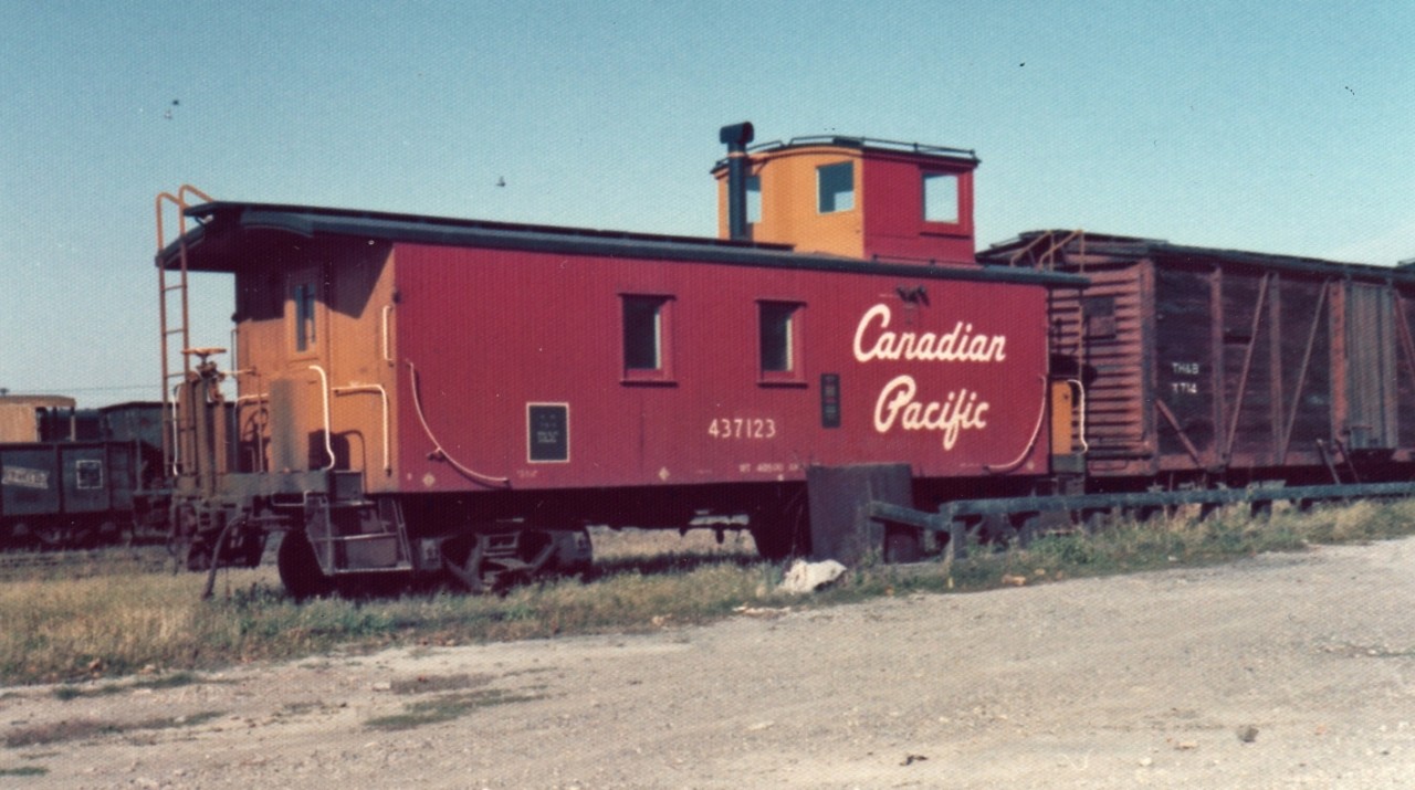 Long before underslung generators, electric heat, large windows, step lights, mandatory roller bearings, and digital cameras, I caught this wood sided CP caboose in TH&B's Aberdeen Avenue yard in Hamilton, ON.  The van was surrounded by a nice mix of old TH&B/CP and newer CP equipment.  Most, if not all of the TH&B stuff would be slowly scrapped over the next few years.