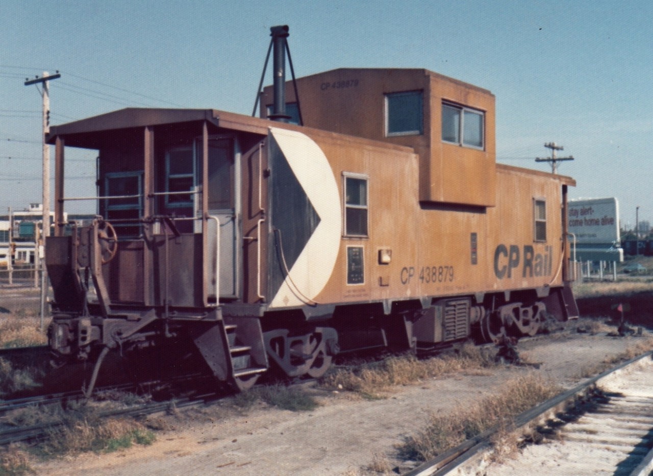 Cruising around in my brand new 1973 Plymouth Duster I stopped in at the CP/TH&B Aberdeen Yard and caught this 'newer' CP steel caboose sitting by itself at the entrance to the yard.  The switch points are well oiled and the weed killer is starting to take affect on these ballast free yard tracks.