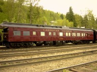 "If I had a million dollars...."  "I would buy me a business car."  Now this is the way to travel!  CP's #83 'Lacombe' brings up the rear of a 2002 test run of steam engine 2816.  The recently painted and polished business car is looking spectacular and is ready to receive high paying guests aboard its luxurious accommodations, however, on this run it is occupied by CP personnel overseeing the maintenance and repairs of the steamer.
