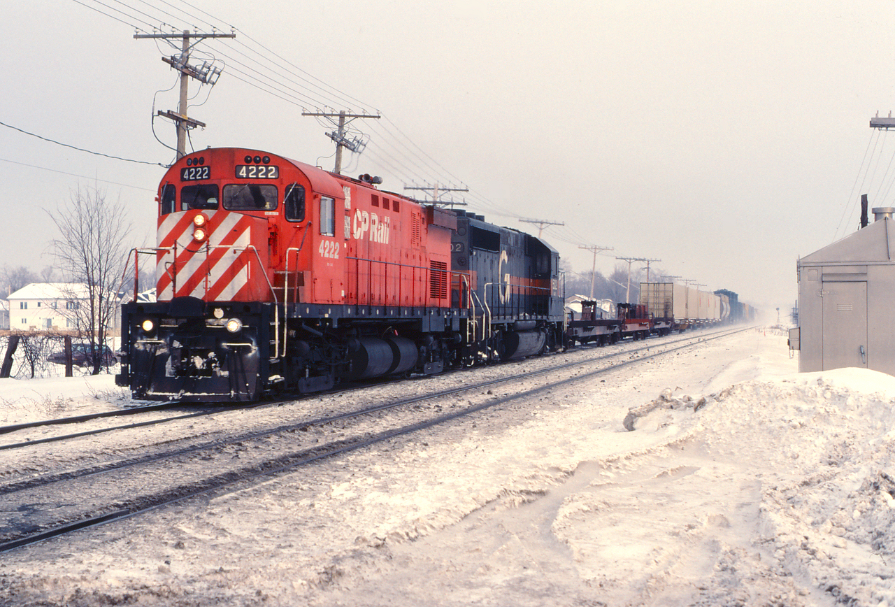 CP 4222 and Guilford 502 highball westward through the commuter zone.