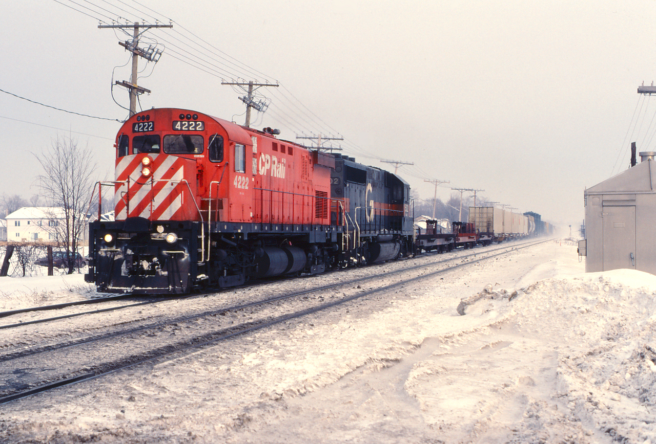 CP 4222 and Guilford 502 highball westward through the commuter zone.