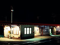 A time exposure of the Franz Station with the ACR/CPR diamond in the foreground. The light streaks are from a westbound train.