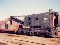Not long for this world, ex-Penn Central 150 ton wrecking crane CR 50125 has been moved from its former home on the CASO in St. Thomas, ON to the CN Reclamation Yard in London, ON. This former facility on the outskirts of London was one of several such plants on CN's system where 'D-453' tagged rolling stock, wrecks, and other no longer needed equipment was sent to be 'permanently' removed from service.  Coulda, shoulda, woulda.  Oh how I wish I had taken more and better photos back when this yard was still active.