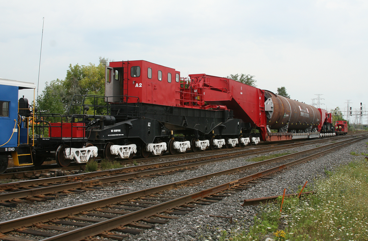 CEBX 800 slowly rolls into the yard at Aldershot, where it will lay over until its evening departure on CN O915.  CEBX 800 is the worlds largest freight car, seen here carrying a load built by Hooper Welding in Oakville bound for a refinery in Kansas; with a 15MPH speed restriction, it will be weeks until it reaches the customer.