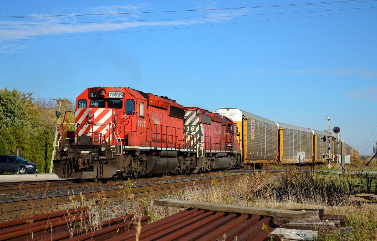CP 543 with a pair of SD40-2's, pulls into the siding in Tilbury to let CP 244 pass by eastbound. CP 543 is the new train number taking the place of CP 441