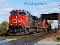 CN 2661 5659 & 2663 leading #369 has just lifted yard switchers 7082 & 4135 along with some loads at Belleville.  The train heads west at the Moira River, Belleville October 11, 2012  