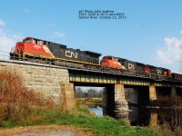 CN #305 crosses the Salmon River at Milltown,  Shannonville wih a manifest train October 25, 2012