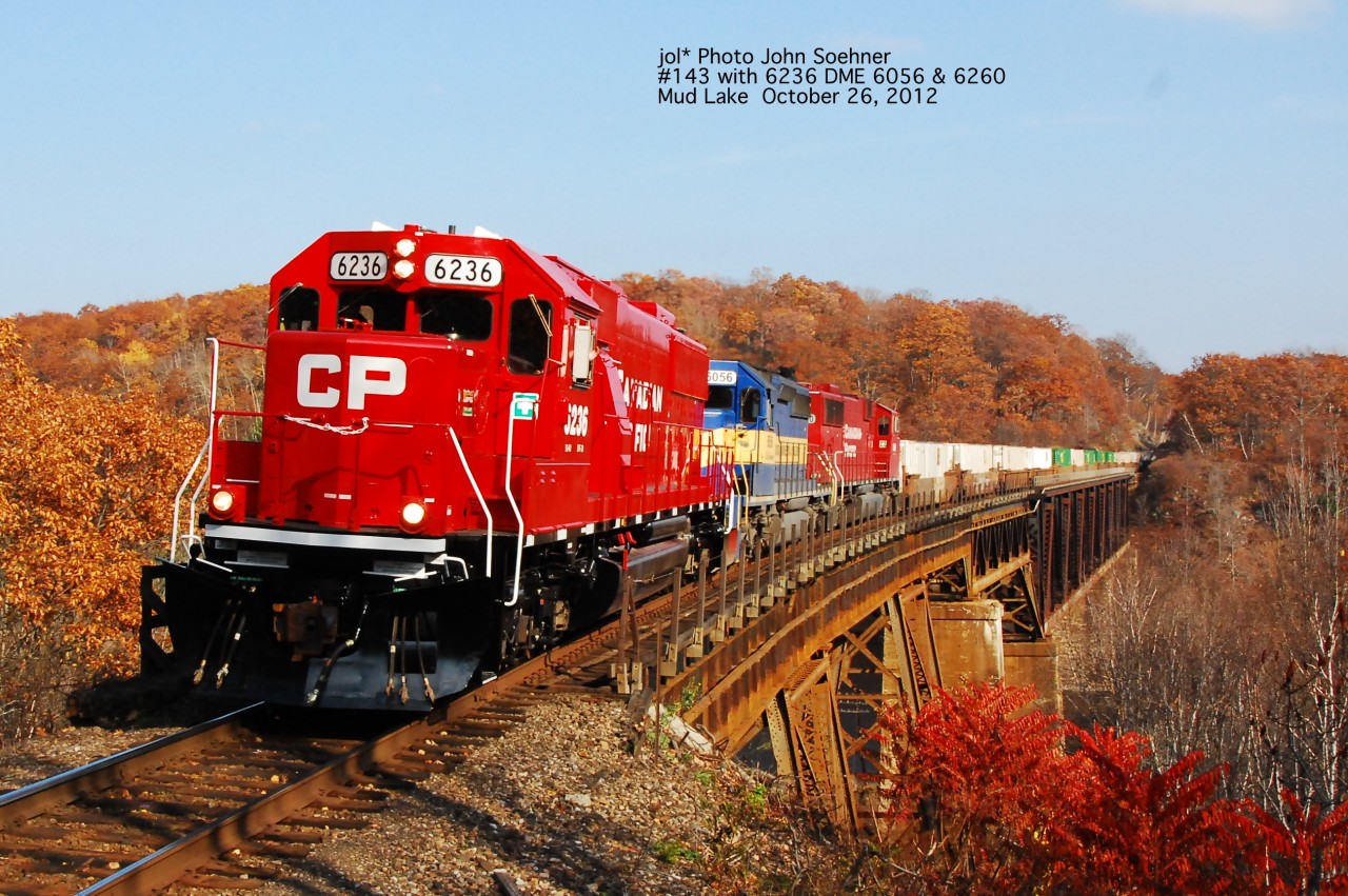 CP 6236, former SOO 6036 DME 6056 and 6260 leads #143 across Mud Lake Trestle.  Note no Jordan Rails on the Mud Lake, as work will commence Monday with new bridge decking on the curved viaduct section of the bridge.