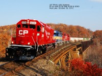 CP 6236, former SOO 6036 DME 6056 and 6260 leads #143 across Mud Lake Trestle.  Note no Jordan Rails on the Mud Lake, as work will commence Monday with new bridge decking on the curved viaduct section of the bridge.