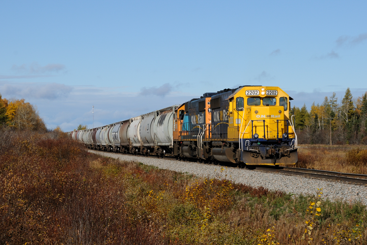 Truddling along the former Canadian Northern mainline that connected Manitoba with Quebec, Work ONT 2202 crawls painfully slow eastward with approximately 30 empties for the Agrium plant. The crew is only a couple miles from hitting the 20 mile spur appropriately named after it's only customer... The Agrium Spur.