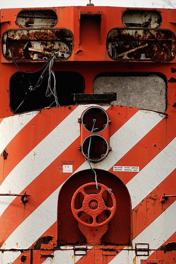 The face of the deceased. Built as RS18, CP 8746 in 1958, rebuilt in 1980 having it's nose chopped along with other upgrades is was reclassified as a RS18u and renumbered 1802, only to be converted to a "Control Cab" fifteen years later in December 1995. By 2002 it had been retired by CP, sold to OSR and moved to Guelph Junction. Today, as it has for close to a decade, the rusted and beaten, salvaged shell of an engine sits feet away from the rails where sister RS18u's ply the rails from parts she has given, so the vintage fleet of First Generation Diesel engines still live into the 21st century.