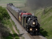 H1b 4-6-4 2816 with a westbound executive special bound for Regina passes the site of an old water tank named Fauna west of Rush Lake Sask.