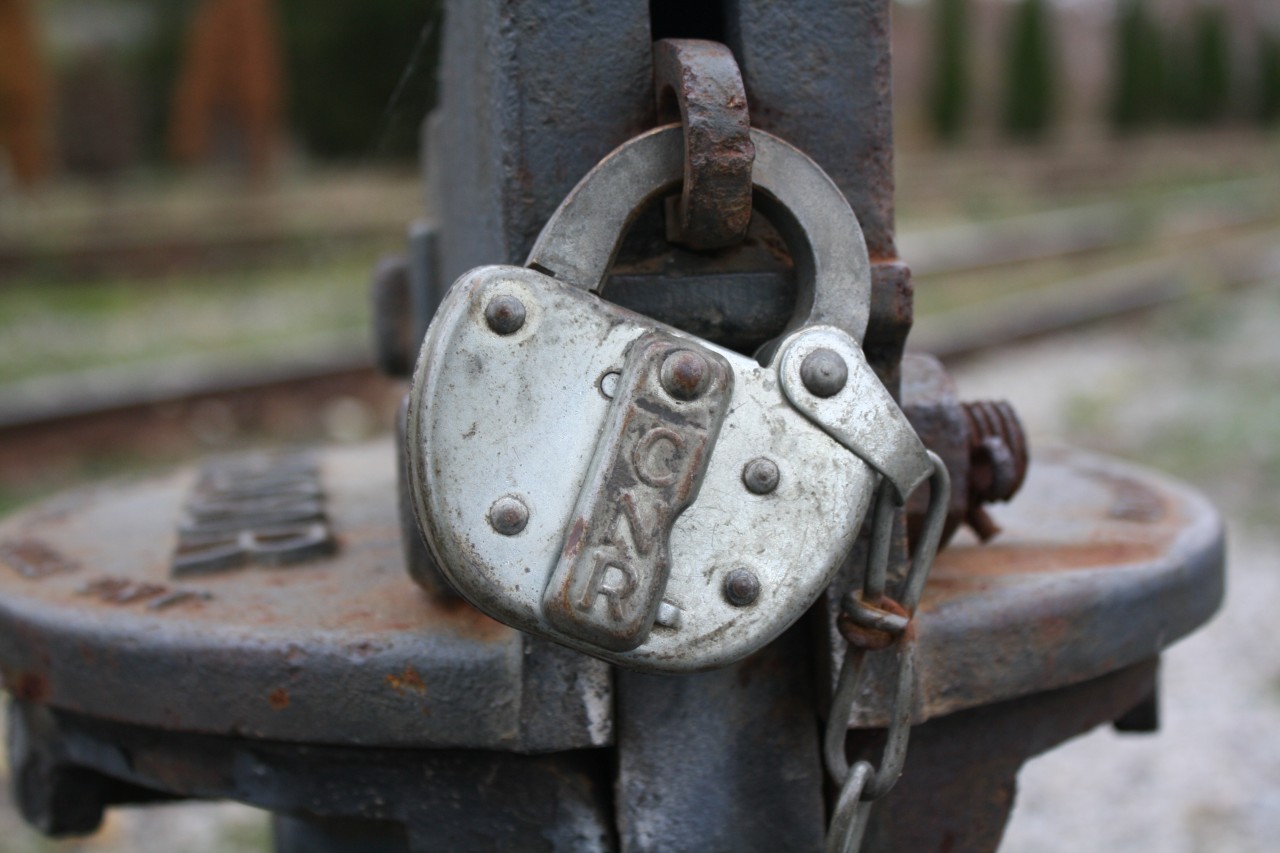 Every switch on a railway is protected by a lock and key,  On the Southern Ontario Railway it is no exception, pictured is a CN lock guarding a switch from being changed unless you have the key.  When I was walking around today, there were more standard padlocks then the original locks on switches.  If this lock could talk it would tell of all the things it has seen over the years...