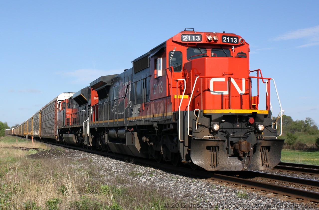 CN 2113 is cruising through Lynden Ontario on a warm May morning.  This was the first ex CNW unit that I have seen leading a freight.  This was an added bonus of a quick stop at the crossing.  Once 2113 cleared CN 393 arrived with a GOT unit dead in tow!  Which made for two good trains in under an hour.