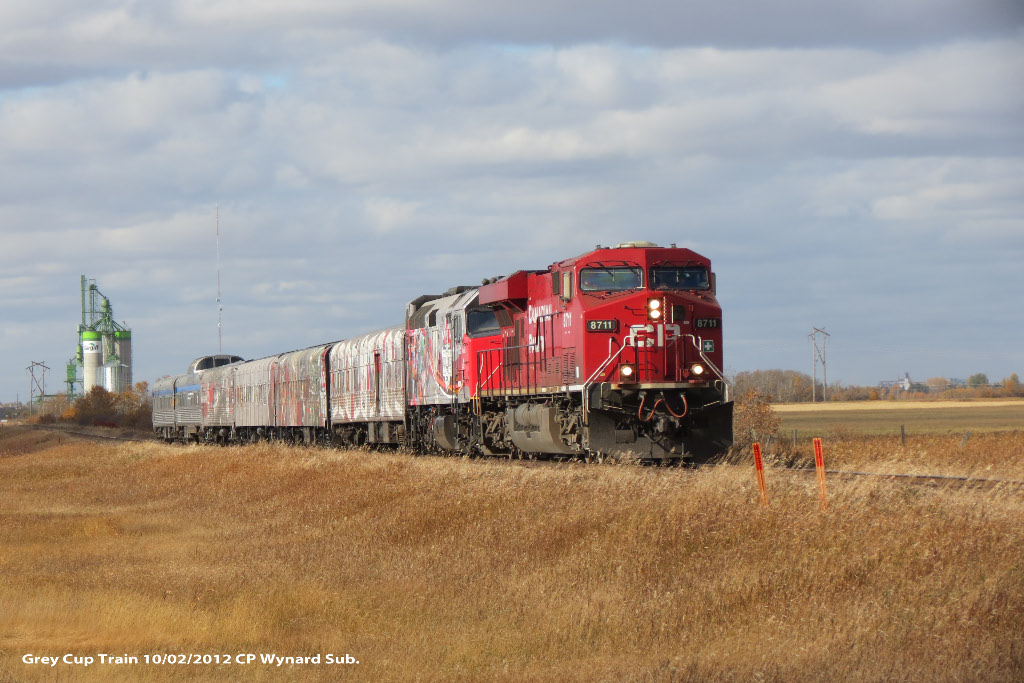 Grey Cup Train is moving East on the Wynard Sub. with units CP 8711, 6445 and 4 coaches showing 100 Years of CFL Football