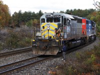 Engineer on O480 was chattin with the photographers and borrowed my good friend Jon Angeles' safety shades for roll-bys for CP 423 and CN M301 at South Parry. Although I suppose he forgot he had them on when he entrained to depart on GTW 5954, so after realizing this, his conductor is seen leaning down, handing JA back his shades.