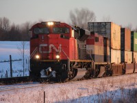 A northbound container train, likely #107, starts to pull after meeting a southbound manifest at the North end of Brechin. 