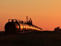 The sunsets on a string of oil tankers at Fairlight Saskatchewan on the CN Cromer Subdivision.