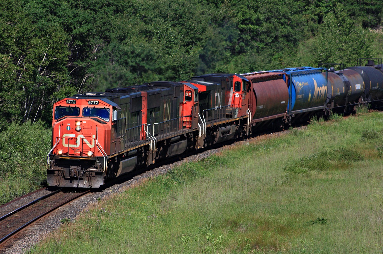 CN 5772 with train 312 rounds the curve east of Rivers MB.