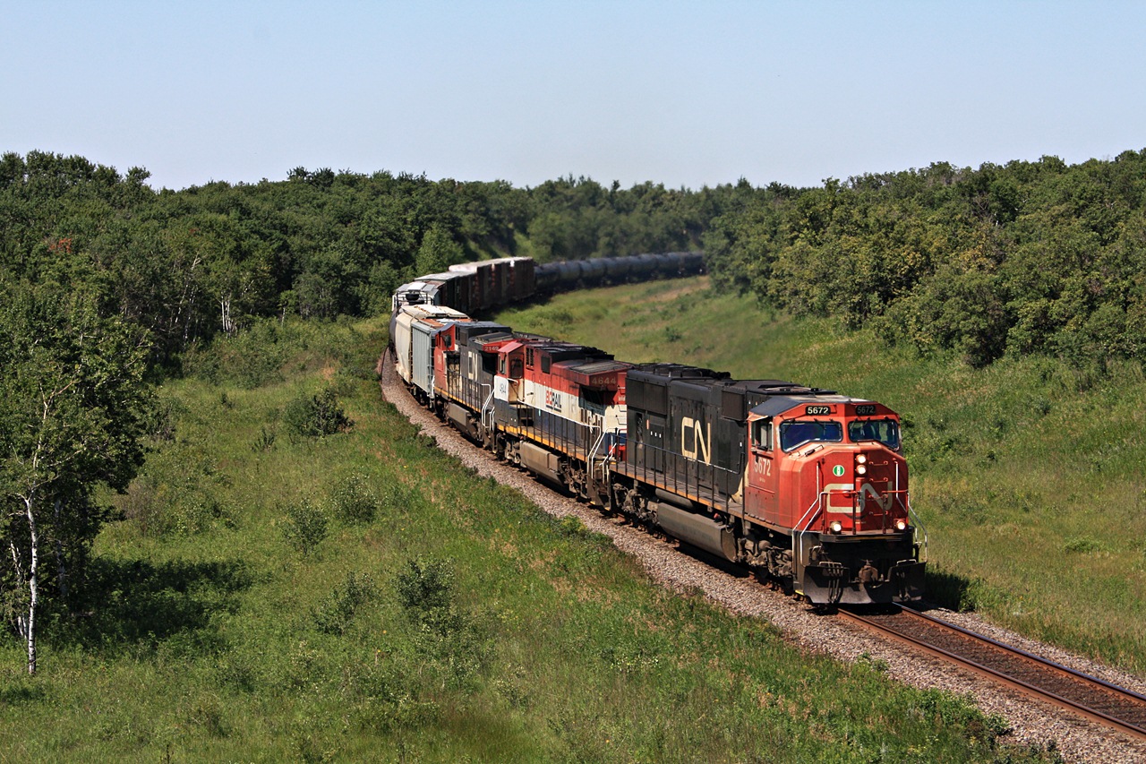 CN 116 with CN 5672 BCOL 4644 and CN 2149 rounds the curve at Rivers MB.