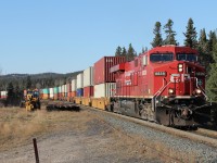 Eastbound intermodal/vehicle train 112 climbs the grade at Neys 