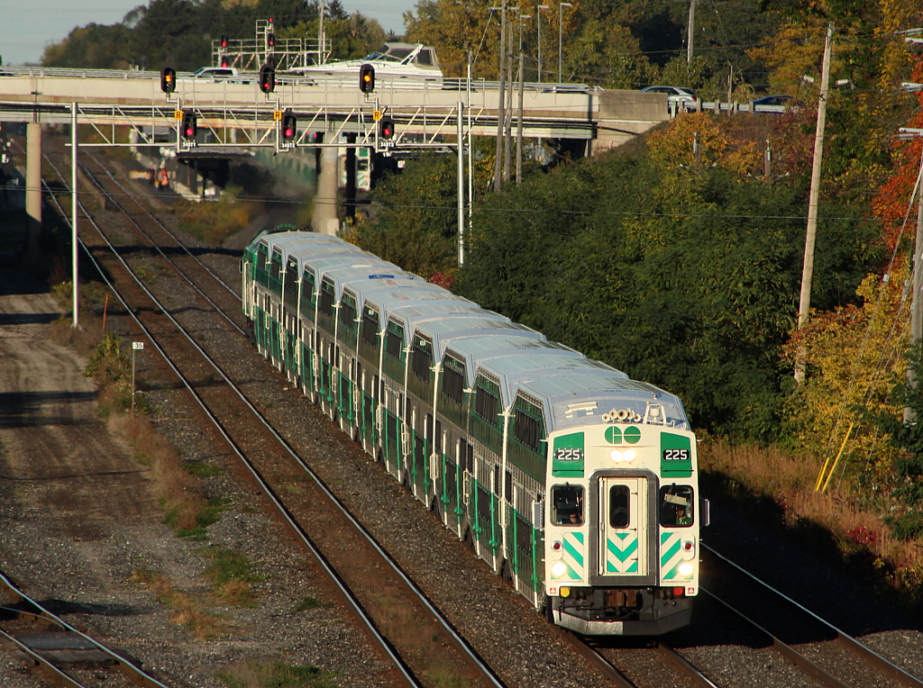 GO 491 has just departed Aldershot for Hamilton, while a boat passes over it on Waterdown Rd.