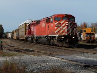 CP 248 with a "Red Barn" in the lead passes through the Guelph Jct and an old CP van now owned by the OSR. 