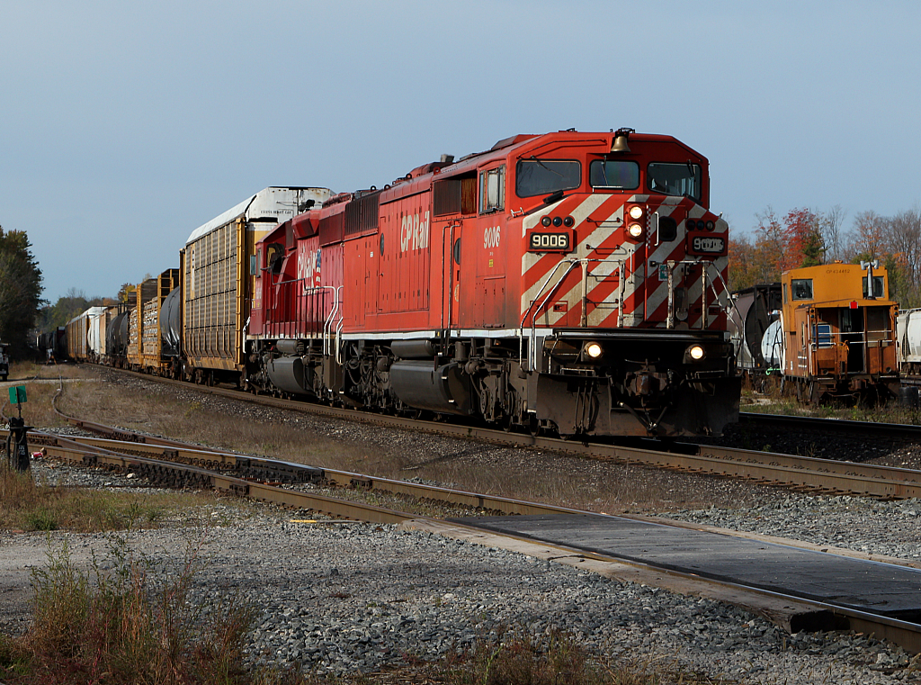 CP 248 with a "Red Barn" in the lead passes through the Guelph Jct and an old CP van now owned by the OSR.
