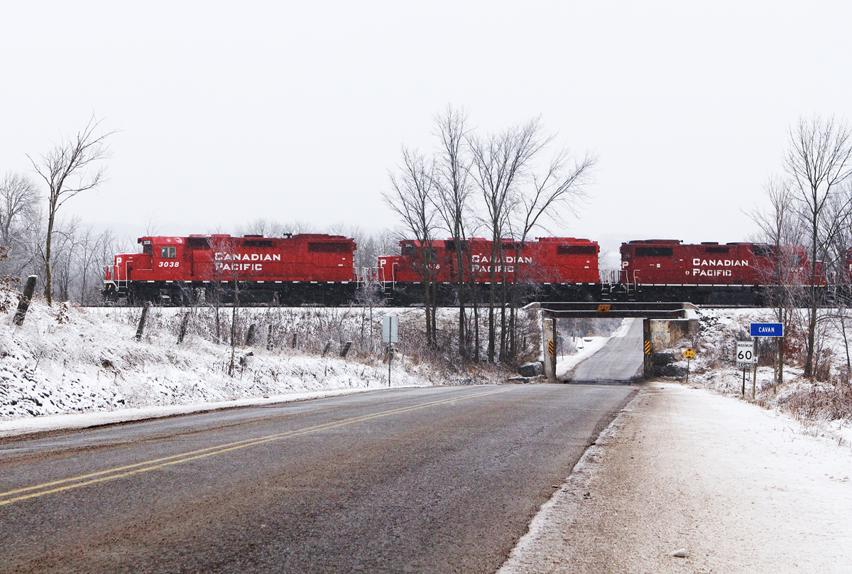 CP's Kawartha Lakes Railway job T07 trundles west over Regional Rd 10 in Cavan, a few miles outside of Peterborough.