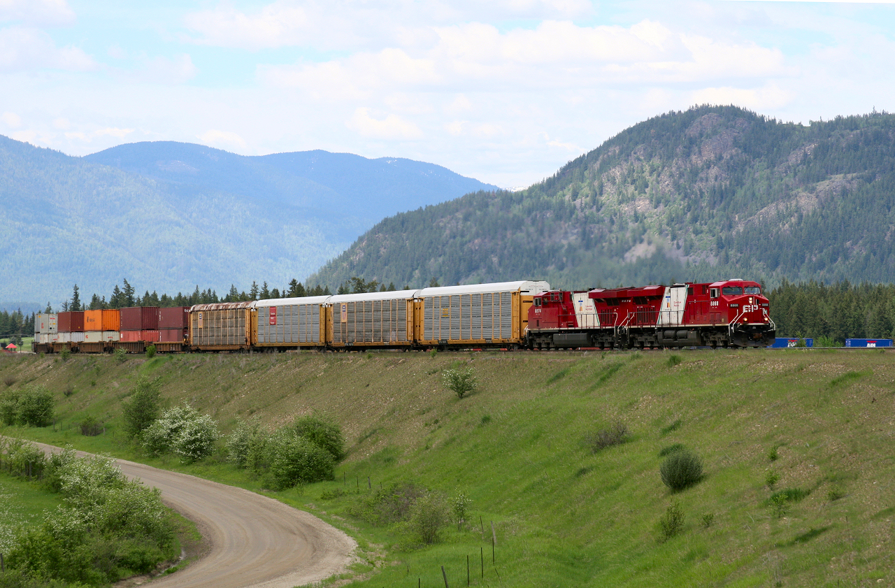 CP 101 grinds upgrade through Notch Hill on restricting signals following a slow unit train.