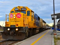 Southbound Northlander (Train 698) at Cochrane, waiting to start its journey. “STOP” signs of protest against the Ontario government's plan to privatize the Ontario Northland were displayed by many homes and businesses in Cochrane, as well as on Ontario Northland structures and equipment. 