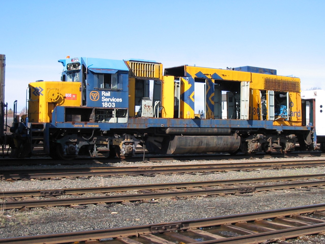 1803 has seen better days.  She now sits skeletonized in the deadline in ONR's North Bay yard.  There are still a few parts left on her that will eventually make to other units, such as the rerailers hanging under the frame just ahead of the fuel tank.