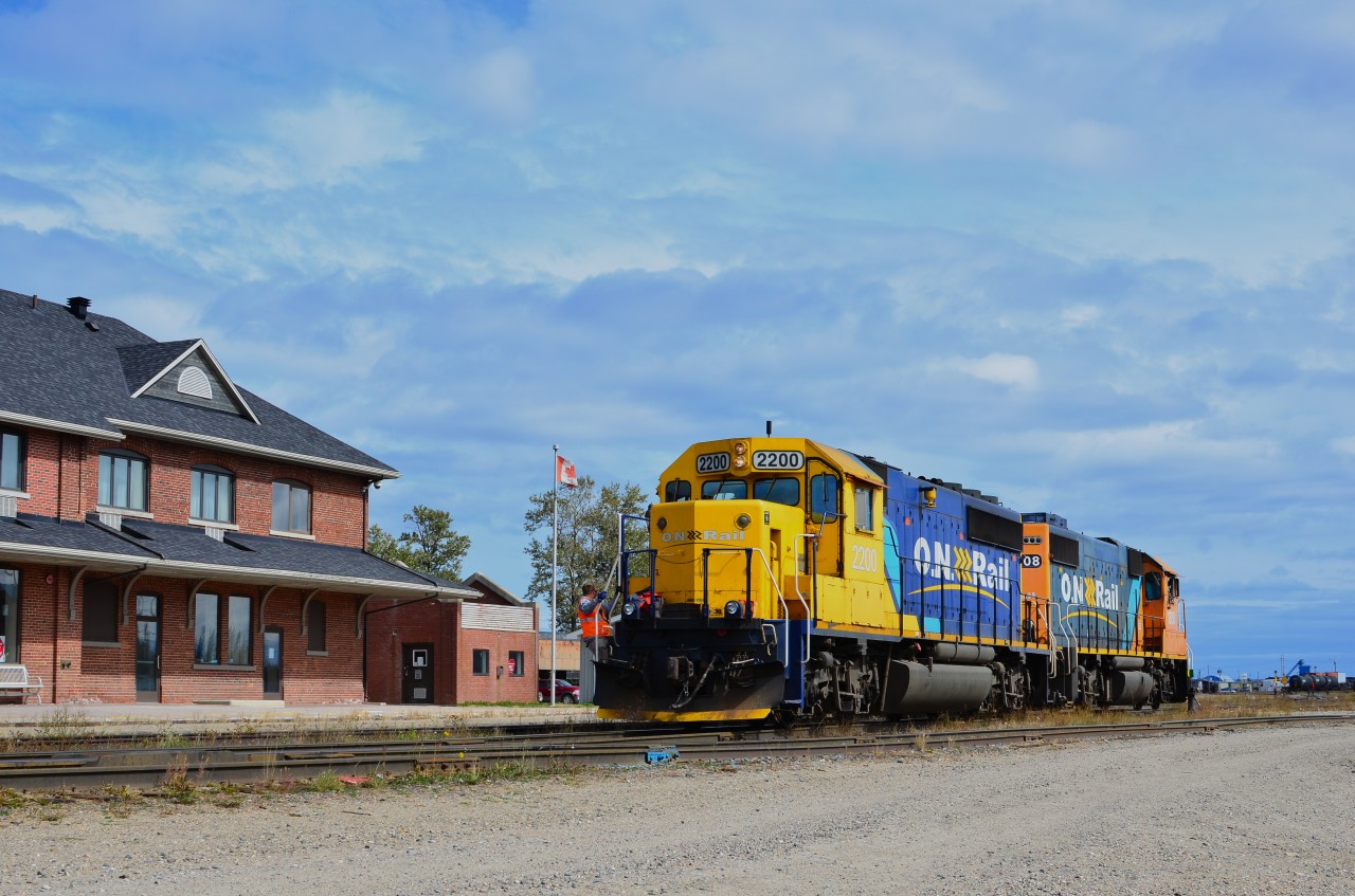 The crew of GP38-2 #1808 and SD40-2 #2200 have just yarded their freight train and are moving the power to the far track in front of the Cochrane station where the units will be parked until they are moved to the shop area 45 minutes later.