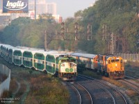 With an unusually large daily Toronto to Cochrane "Northlander" with 2 ex-CN cars, 5 ex-GO single levels and an APU tacked on the rear, ONT GP38-2's 1801 and 1806 pull equipment move #697 from Mimico to Union Station,  passing GO 553 off Milton Line run #152 at Bathurst St (8:03am).  Upon discontinuation by the Ontario Liberal government at the end of September 2012, this train and the vital link it serves as a connection between small communities along the line in Northern Ontario is now history.