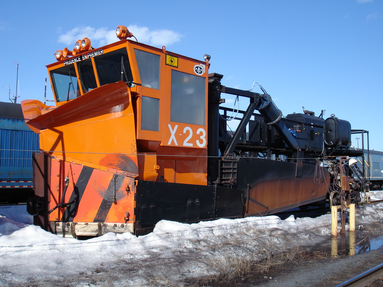 Cartier Railway's highly modified Jordan spreader #X-23 has not been treated too rough since its last major service and paint.  The orange and black gloss paint shines nicely in the welcome sunshine on this beautiful end of May day.