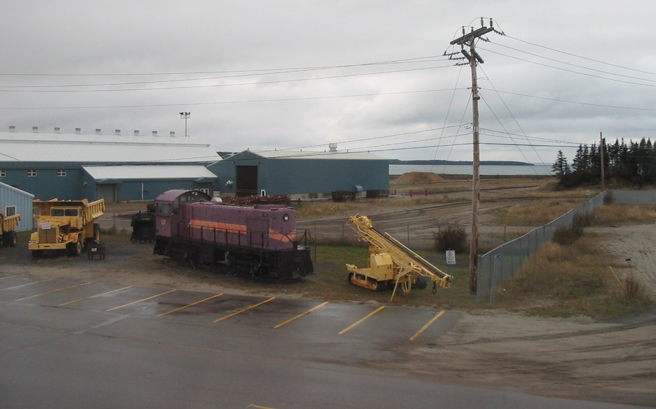 As viewed from my room at the Hotel du Havre on a cold and rainy October afternoon, QIT 1 (nee QIT 4), 1951 built MLW S4 sits forlornly at the entrance to the shop and office complex in Havre St-Pierre.