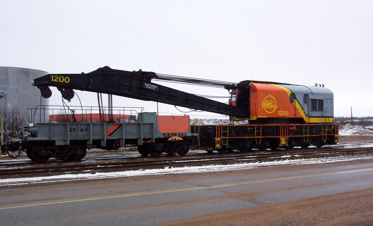 Now this will brighten up any dingy wreck site!  QNS&L 1200, a Bucyrus Erie 250 ton capacity wrecker sits majestically outside the locomotive & car repair shop in Sept-Iles waiting for its next assisgnment. 1200's twin sits on the other end of the line in Labrador City.