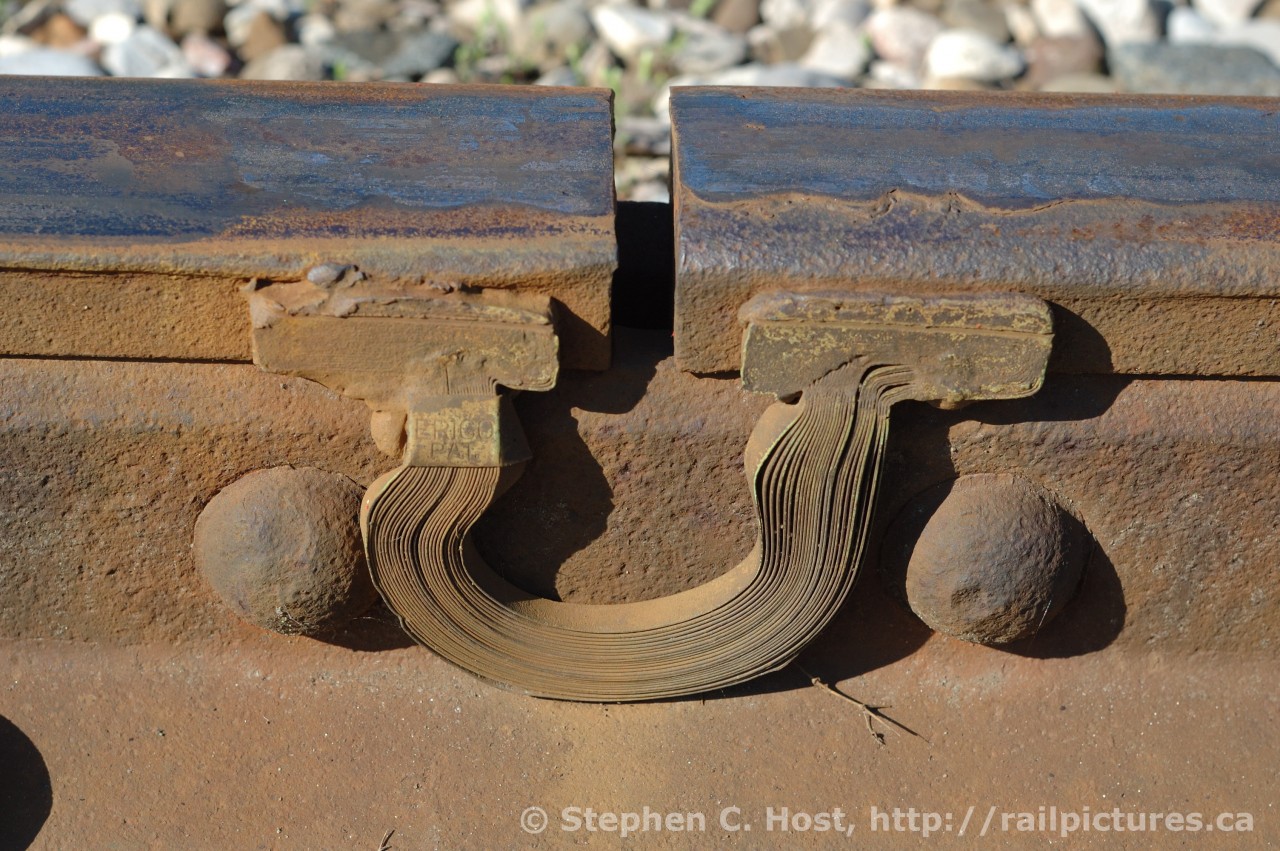 Bond Wire: The Grand River Railway's electric traction motors have not plied the rails in 46 years, but the bond wires used to complete the circuit through the rails between the 1500 V trolly wire and the substation (in this case located at Preston, Ontario) are still installed on the old trackage as of 2007. Freight cars until recently used this trackage which has been made redundant by CPR's  Wolverton yard.