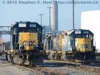 The new and the old - Y120 (left) with CSXT 2697 and 2690 is passing the new Beltpack equipped 2570, with a crew (Consisting of existing CSX Sarnia employees familiar to this Photographer) in training in the cab.  Note the pair of strobes and radio antennae on the cab roof of 2570. Also notice the smaller single strobe on 2697 (which is also on 2570) just above the radiators - anyone have an idea what these may have been installed for? (These are NOT for remote control operations and have never been seen in use)