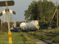 A Bizarre derailment - the crew stopped the train just feet from the loaded Pole car sitting in the team track. The Fire Department is on-site attempting to assess what to do. Note: The car was empty and this track is other than main track (Rule 105)