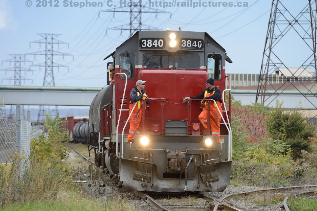 The crew on NECR 3840 share a laugh while discussing switching (I believe one crew was a Trainee) at the CP/CN (SOR) Interchange in the heart of industrial Hamilton, Ontario.