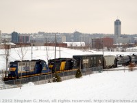 A SOR (Southern Ontario Railway) yard job has entered the N&NW spur and is passing the approach signal with the hamilton skyline in the background. The steel train just cleared onto the mainline moments before this train took appeared. Note that the SOR 4200 (ex CBNS)  has been scrapped and 1808 is out of service.