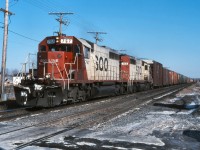 SOO 767 and SOO 765 power a westbound manifest through Beaurepaire on a chill February afternoon