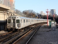 A northbound subway train of aluminum Thunder Bay-built T1 subway cars pulls into the TTC's Davisville Station in the evening.